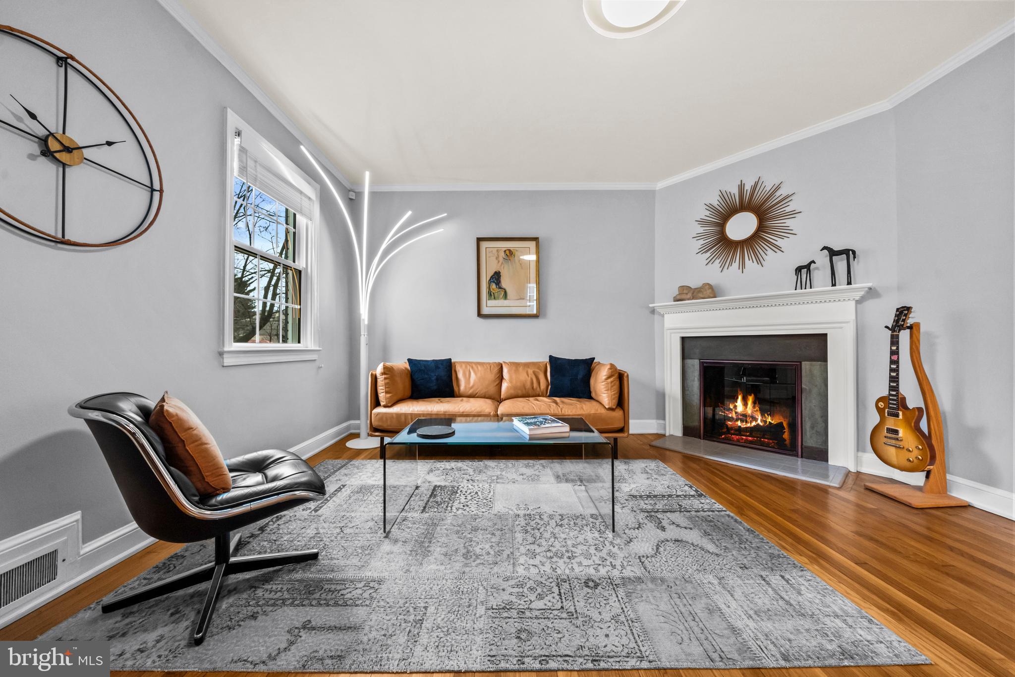 4228 40th Street Northwest Washington, DC 20016 - Photo 6 of 57 a living room with furniture and a fireplace