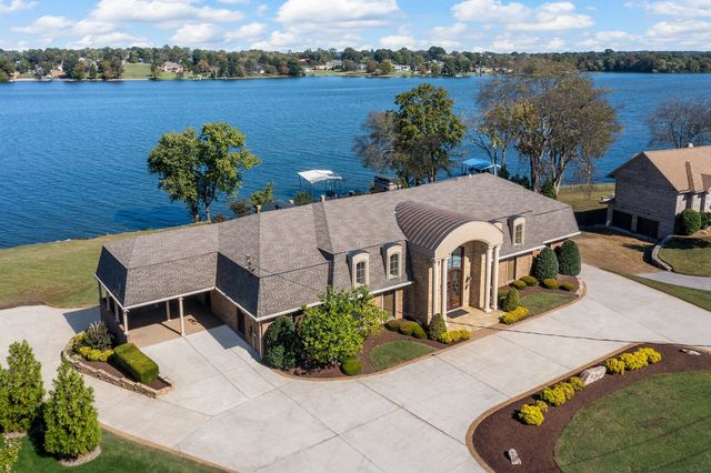 a bedroom with furniture and wooden floor
