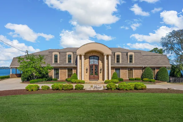 a bathroom with a double vanity sink mirror and shower