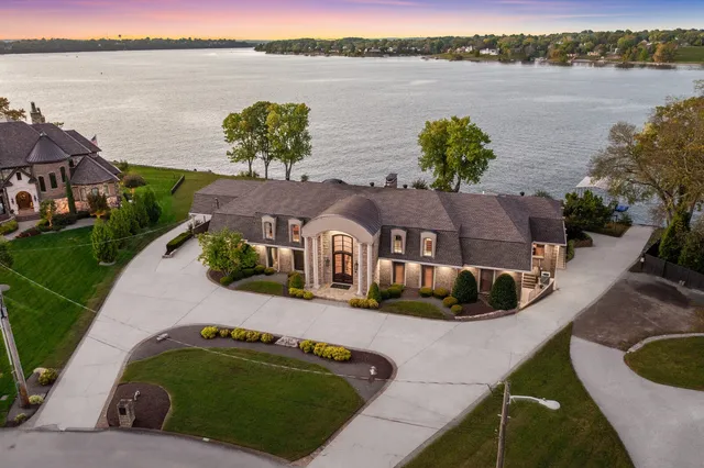 a view of a lake with houses in the background