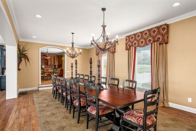 a bed room with a bed and a chair