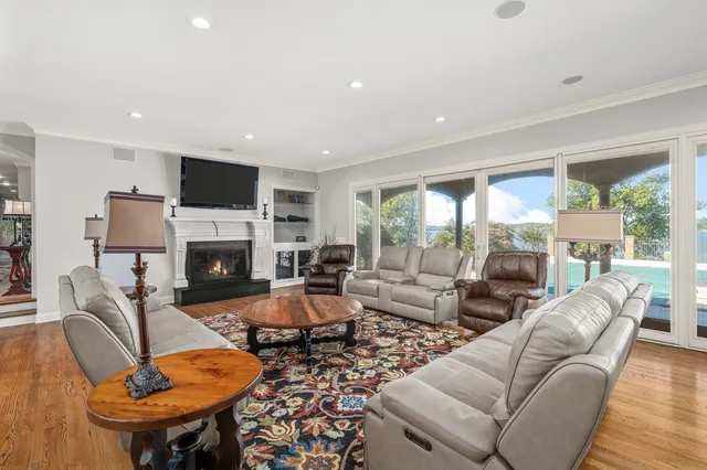 a spacious bathroom with a granite countertop sink a mirror and a vanity