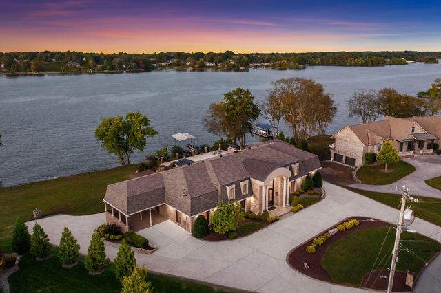 a view of a lake with a house in the background