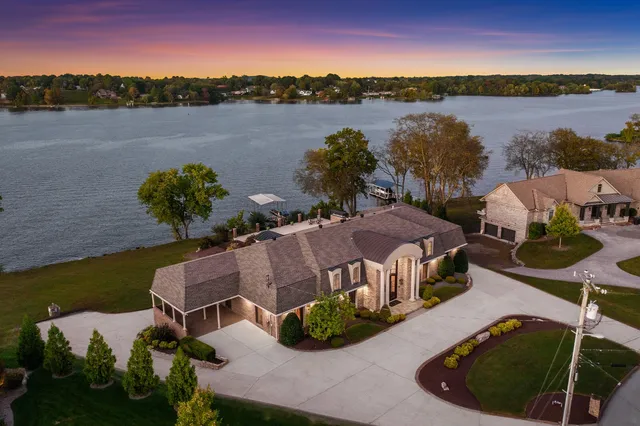a view of a lake with a house in the background