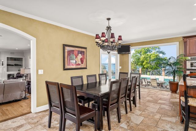 a kitchen with stainless steel appliances granite countertop a sink and cabinets