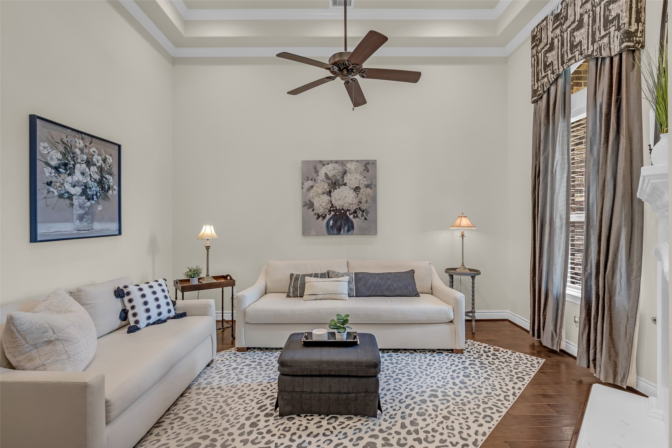 14003 South Evergreen Ridge Court Conroe, TX 77384 - Photo 6 of 43 Sophisticated flex room featuring a tray ceiling and floor-to-ceiling custom draperies, ideal for a home office or second living space.