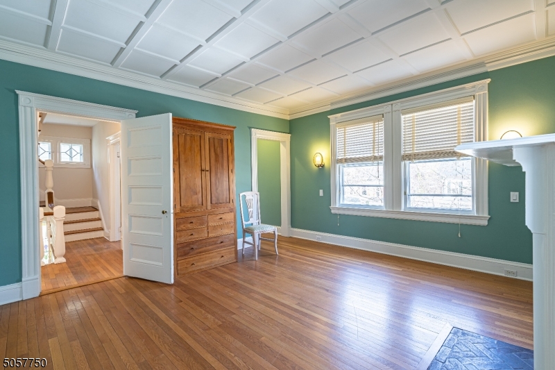 12 Wetmore Avenue, Unit 1 Morristown, NJ 07960 - Photo 11 of 26 an empty room with wooden floor closet and windows