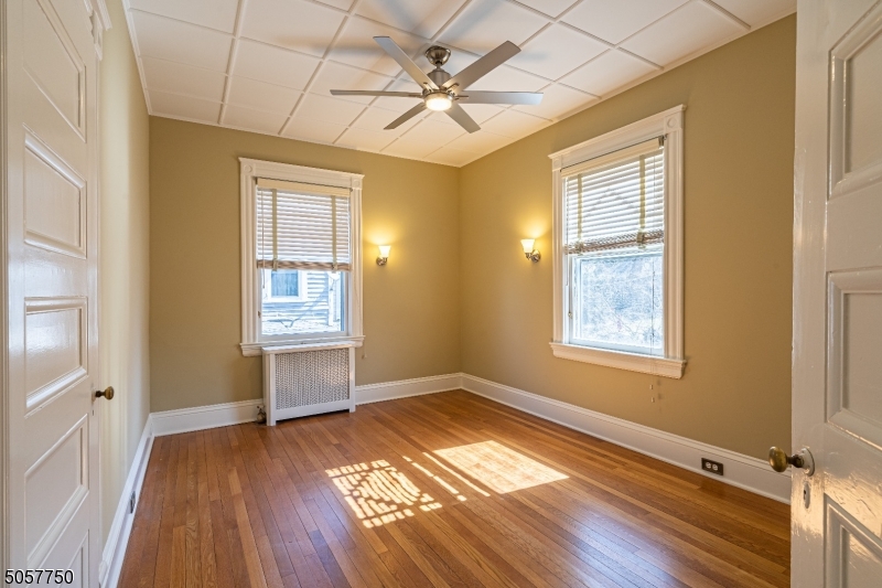 12 Wetmore Avenue, Unit 1 Morristown, NJ 07960 - Photo 14 of 26 wooden floor in an empty room with a window