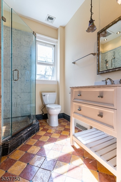 12 Wetmore Avenue, Unit 1 Morristown, NJ 07960 - Photo 16 of 26 a spacious bathroom with a toilet a sink and shower