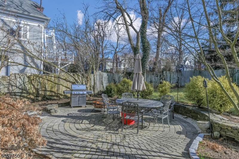 12 Wetmore Avenue, Unit 1 Morristown, NJ 07960 - Photo 24 of 26 a view of backyard with table and chairs and potted plants