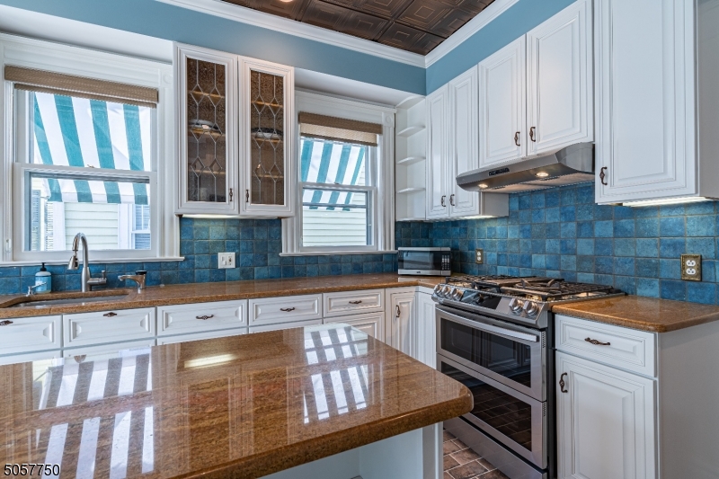12 Wetmore Avenue, Unit 1 Morristown, NJ 07960 - Photo 7 of 26 a kitchen with stainless steel appliances granite countertop a stove a sink and a granite counter tops