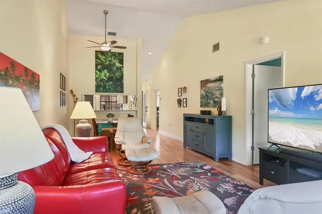 a kitchen with stainless steel appliances granite countertop a refrigerator a stove a sink and a microwave