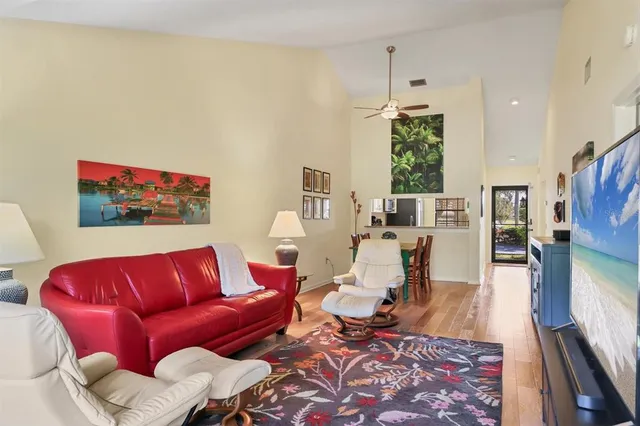 a kitchen with a sink cabinets and a wooden floor