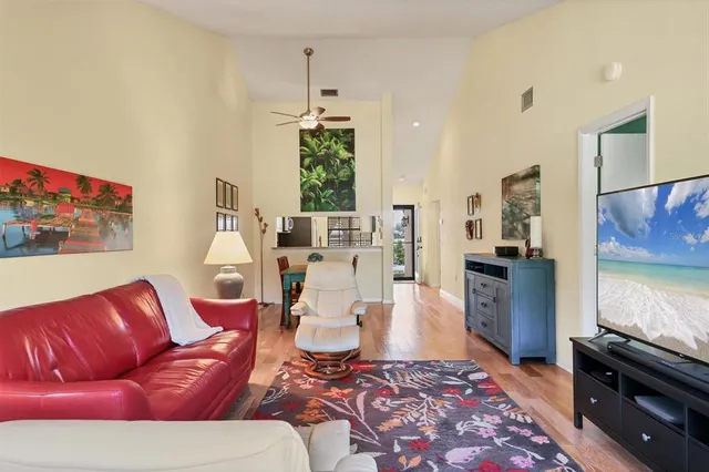 a kitchen with granite countertop a sink stove and refrigerator