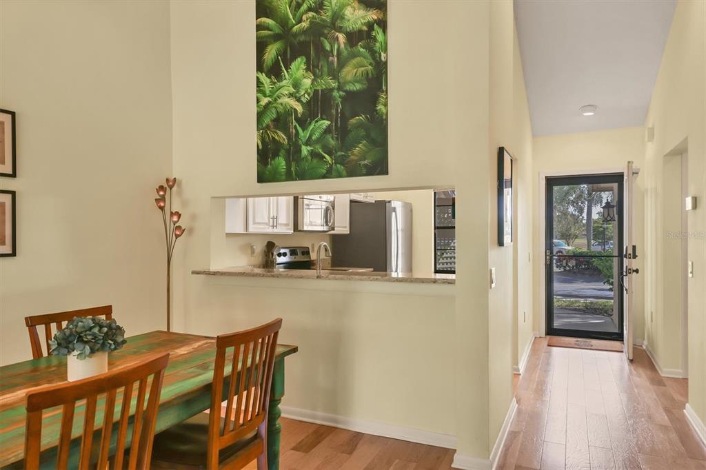 4513 Morningside, Unit 4 Sarasota, FL 34235 - Photo 14 of 81 a view of a dining room with furniture and wooden floor