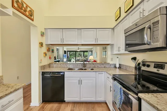 a bedroom with a bed and a lamp