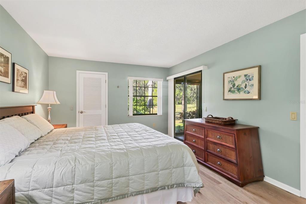 4513 Morningside, Unit 4 Sarasota, FL 34235 - Photo 22 of 81 a bedroom with a bed dresser and window