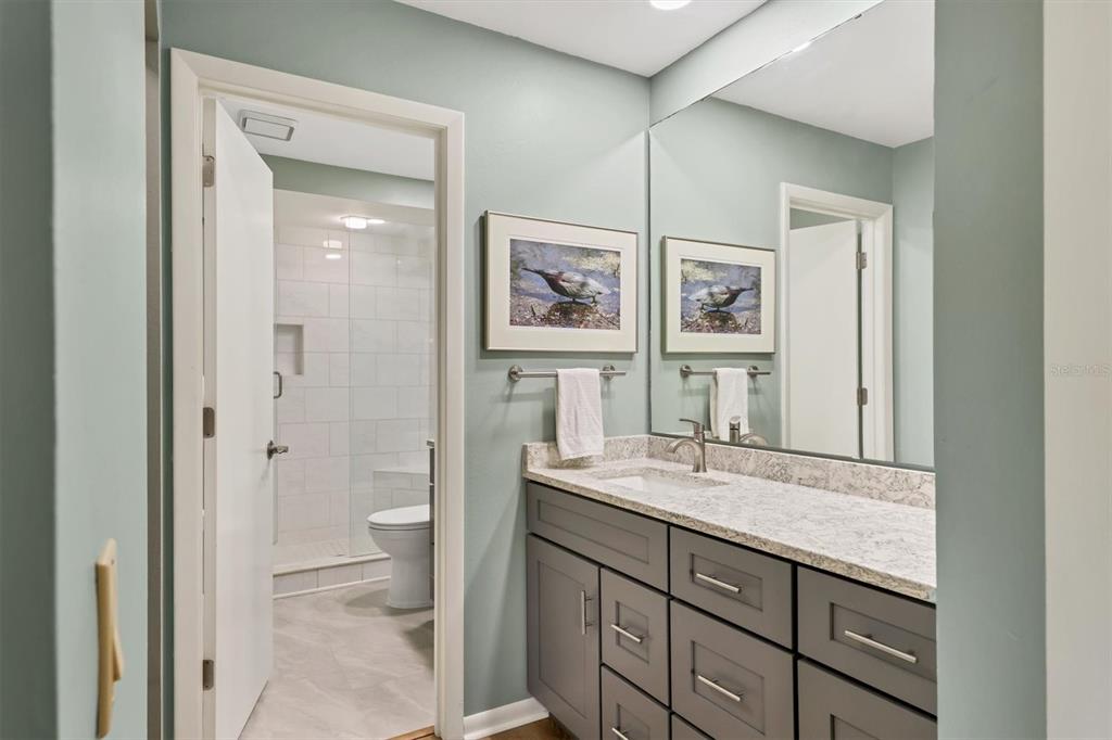 4513 Morningside, Unit 4 Sarasota, FL 34235 - Photo 24 of 81 a bathroom with a granite countertop sink mirror vanity and toilet