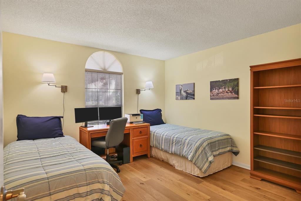 4513 Morningside, Unit 4 Sarasota, FL 34235 - Photo 27 of 81 a bedroom with a bed and a window