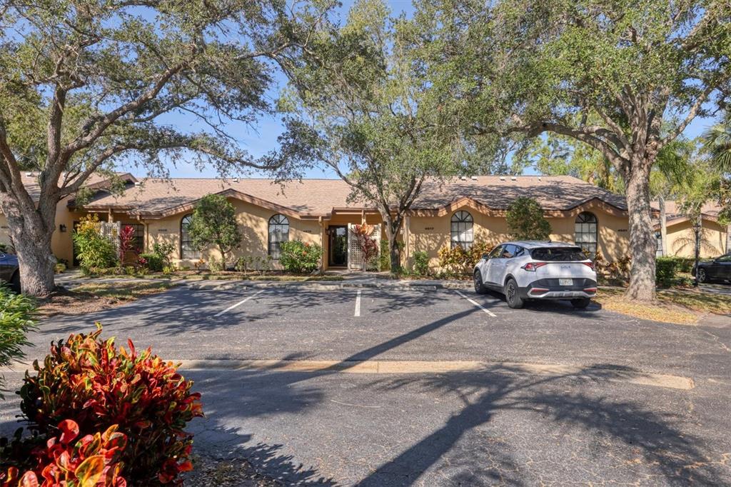 4513 Morningside, Unit 4 Sarasota, FL 34235 - Photo 3 of 81 a view of a street with a couple of cars parked on the roadside