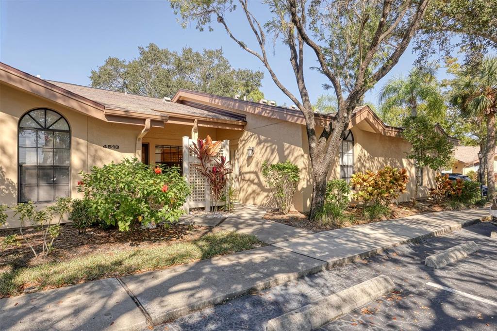 4513 Morningside, Unit 4 Sarasota, FL 34235 - Photo 4 of 81 a view of a yard with plants and large trees
