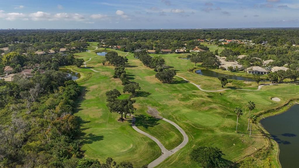 4513 Morningside, Unit 4 Sarasota, FL 34235 - Photo 68 of 81 an aerial view of residential houses with outdoor space and trees