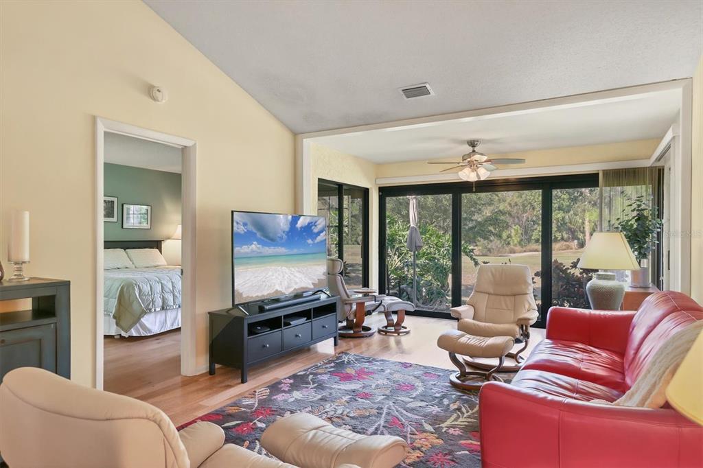 4513 Morningside, Unit 4 Sarasota, FL 34235 - Photo 8 of 81 a living room with furniture and a flat screen tv