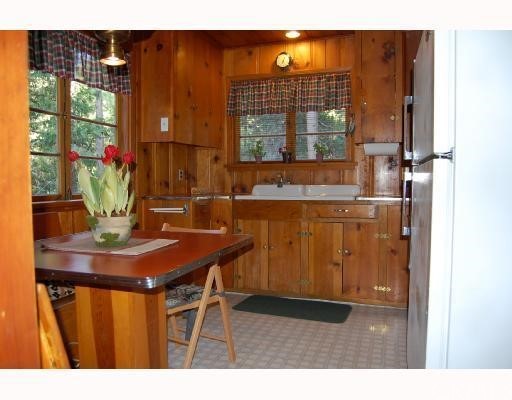 29053 Cedar Terrace Lake Arrowhead, CA 92321 - Photo 2 of 8 a dining room with furniture and window