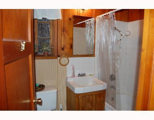 29053 Cedar Terrace Lake Arrowhead, CA 92321 - Photo 6 of 8 a bathroom with a sink and a mirror