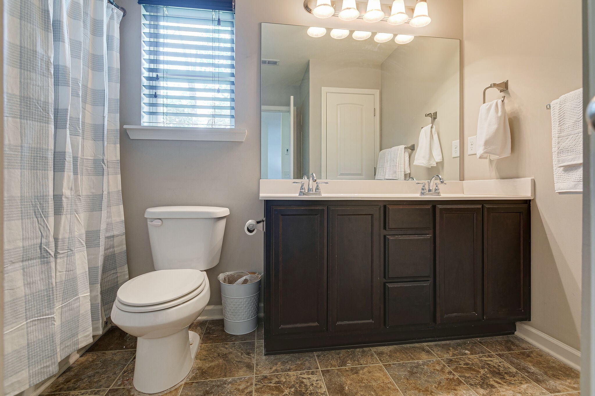 1122 Golf View Way Spring Hill, TN 37174 - Photo 22 of 27 a bathroom with a toilet sink and mirror