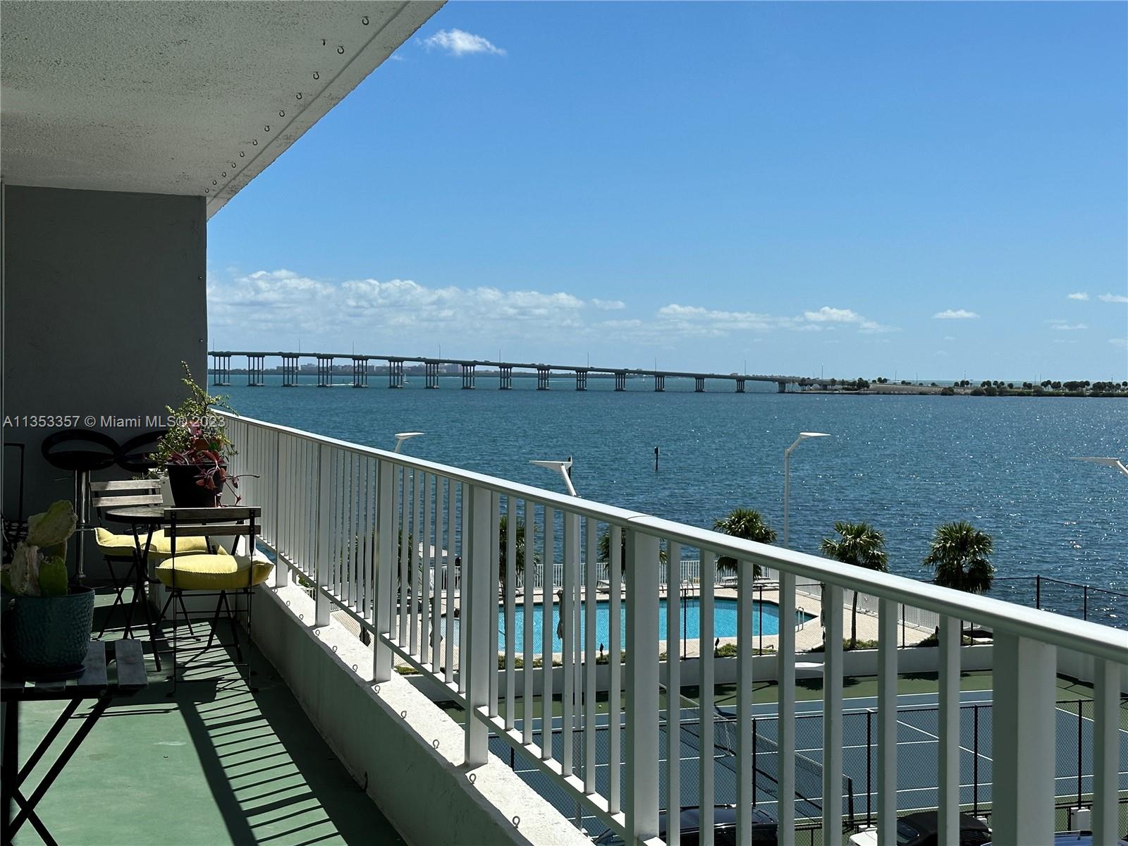 200 Southeast 15th Road, Unit 5J Miami, FL 33129 - Photo 11 of 20 a view of a balcony with wooden floor and outdoor space