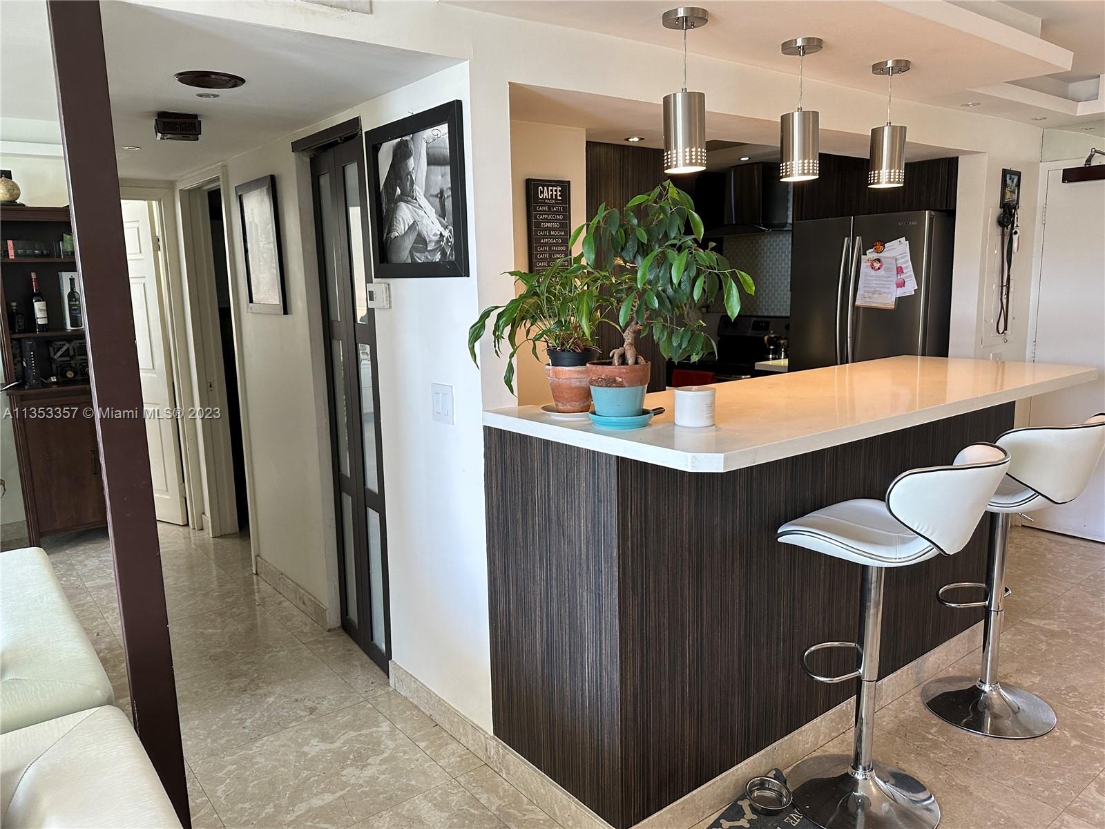 200 Southeast 15th Road, Unit 5J Miami, FL 33129 - Photo 4 of 20 a view of a dining room with furniture