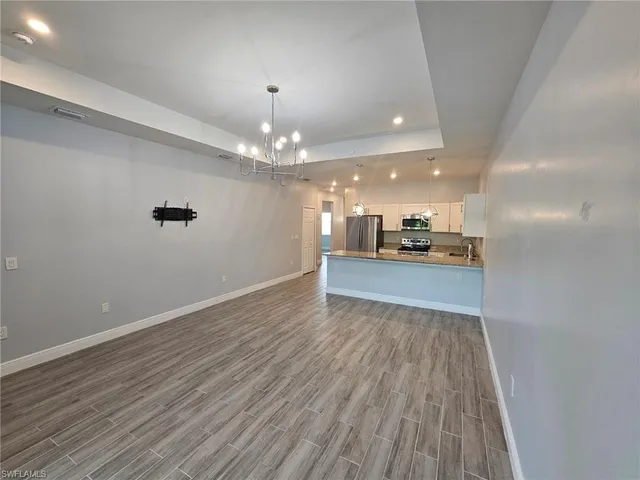 a view of a livingroom with a kitchen