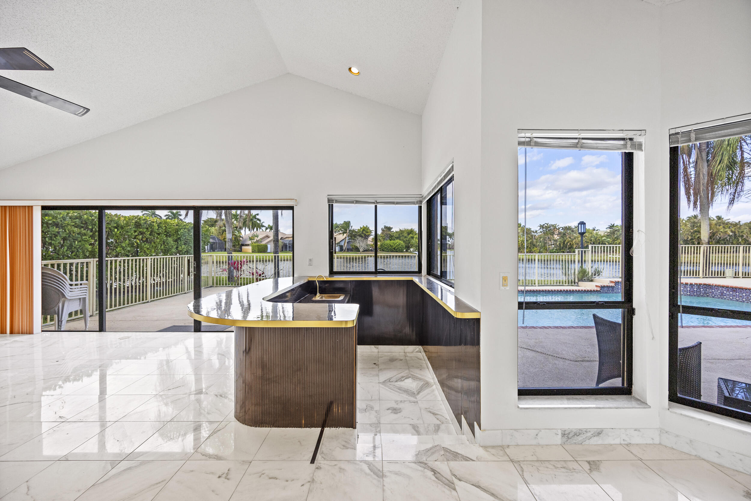 10747 Stonebridge Boulevard Boca Raton, FL 33498 - Photo 31 of 81 a living room with furniture and large windows