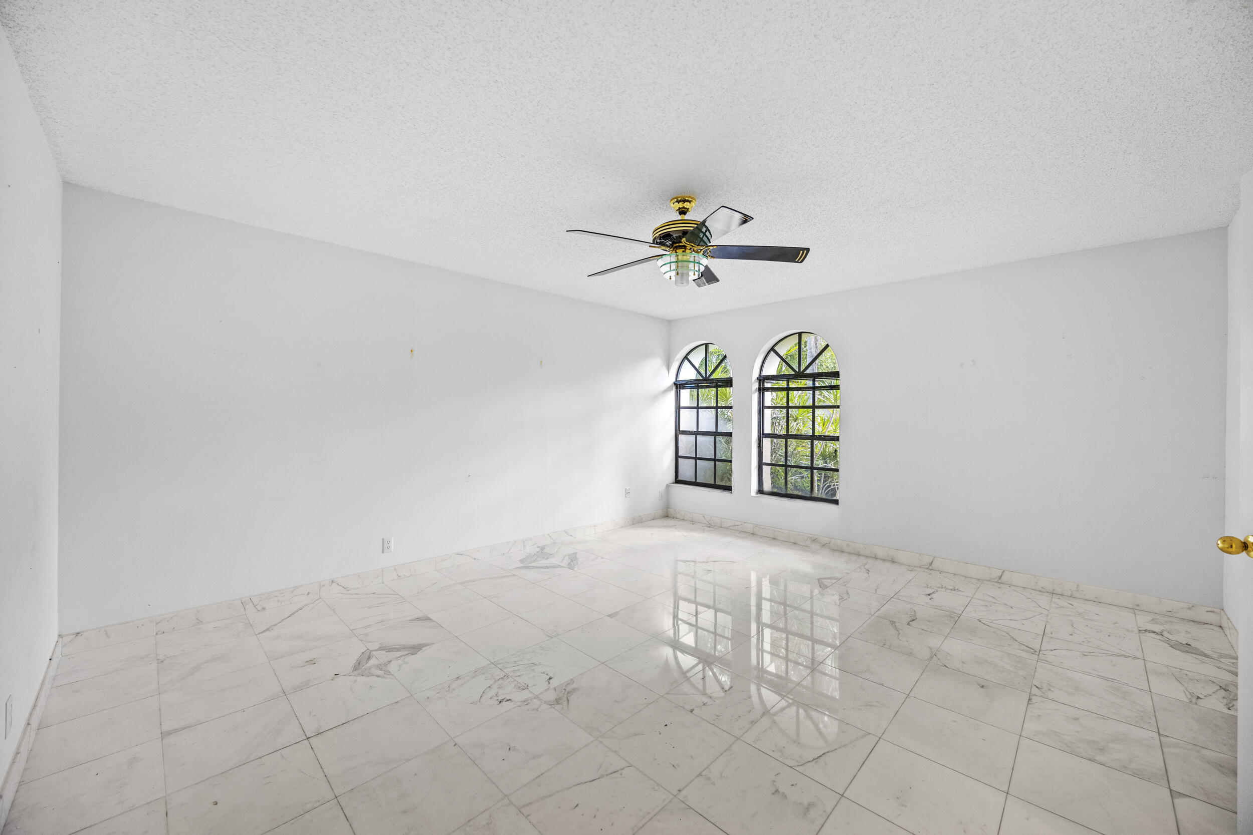 10747 Stonebridge Boulevard Boca Raton, FL 33498 - Photo 32 of 81 a view of an empty room with a window