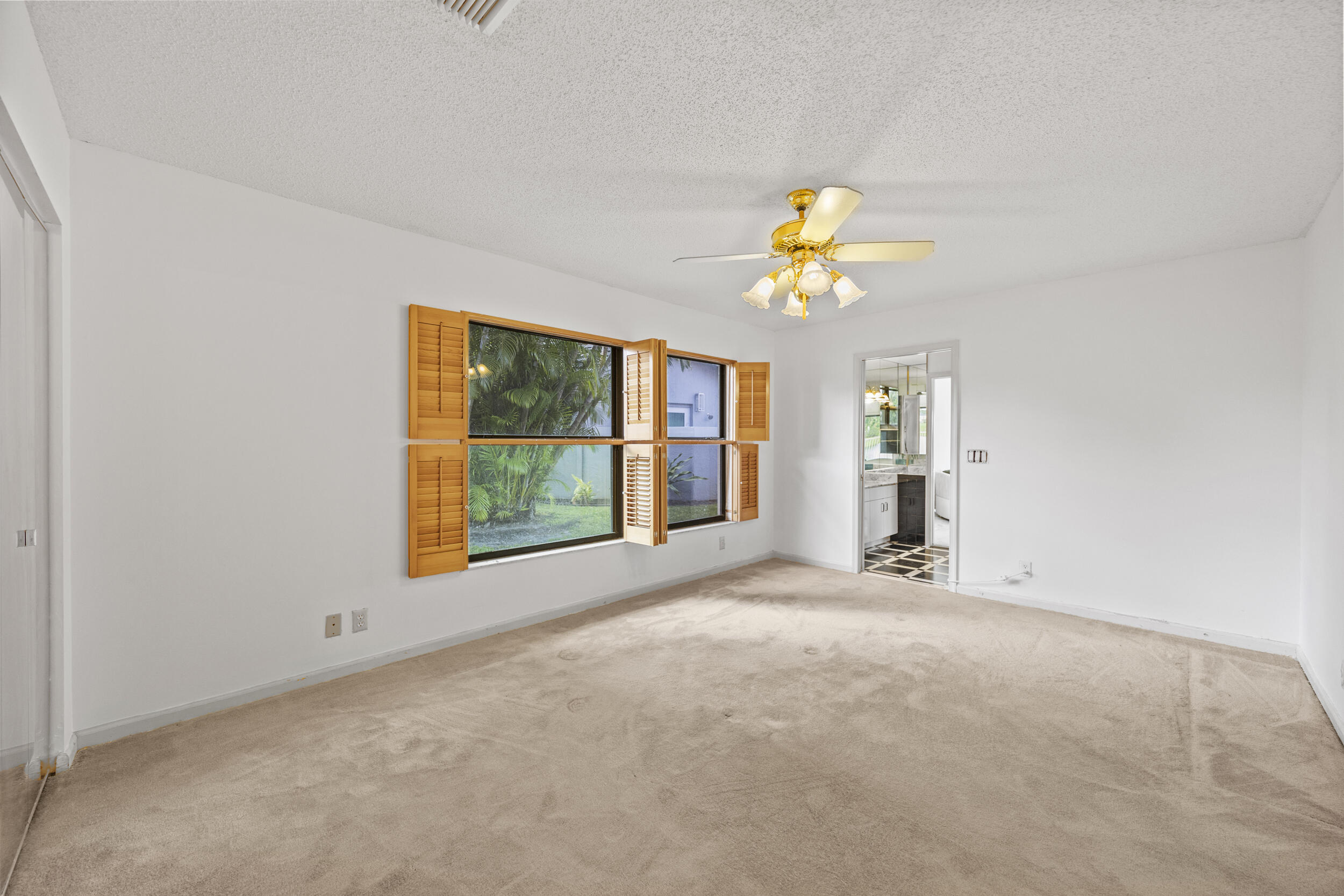10747 Stonebridge Boulevard Boca Raton, FL 33498 - Photo 36 of 81 a view of an empty room with a window