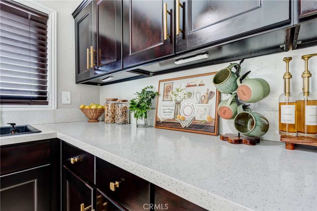 6688 Phoenix Avenue Riverside, CA 92504 - Photo 12 of 26 a kitchen with stainless steel appliances a sink a stove and cabinets