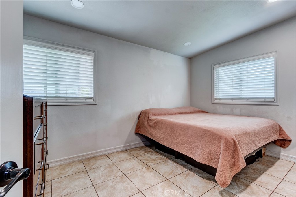 6688 Phoenix Avenue Riverside, CA 92504 - Photo 18 of 26 a bedroom with a bed and a window