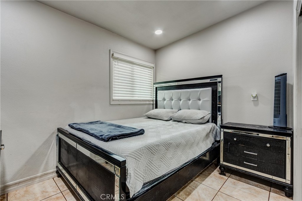 6688 Phoenix Avenue Riverside, CA 92504 - Photo 22 of 26 a bedroom with a bed and a dresser
