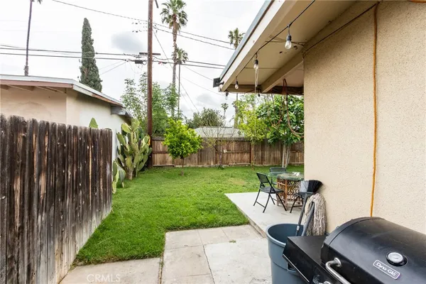 a view of a chairs and table in patio