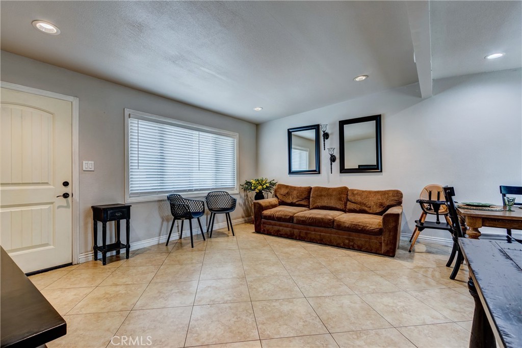 6688 Phoenix Avenue Riverside, CA 92504 - Photo 5 of 26 a living room with furniture and a window