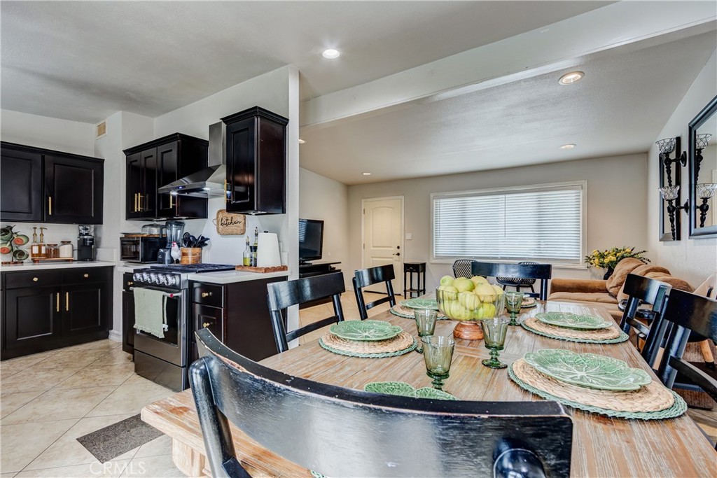 6688 Phoenix Avenue Riverside, CA 92504 - Photo 9 of 26 a kitchen with a dining table and chairs