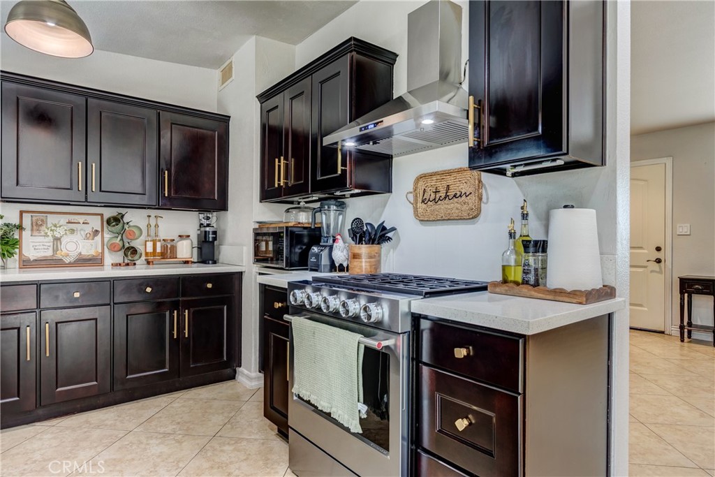 6688 Phoenix Avenue Riverside, CA 92504 - Photo 10 of 26 a kitchen with stainless steel appliances granite countertop a stove and a sink