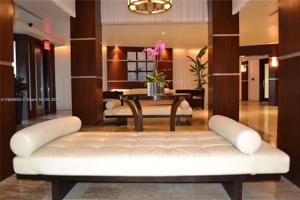 a room with table chairs and a wooden floor