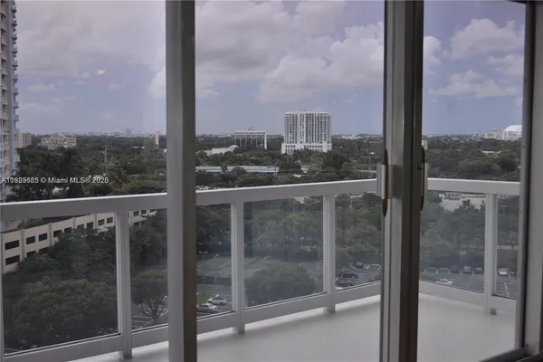 a view of a balcony with a floor to ceiling window