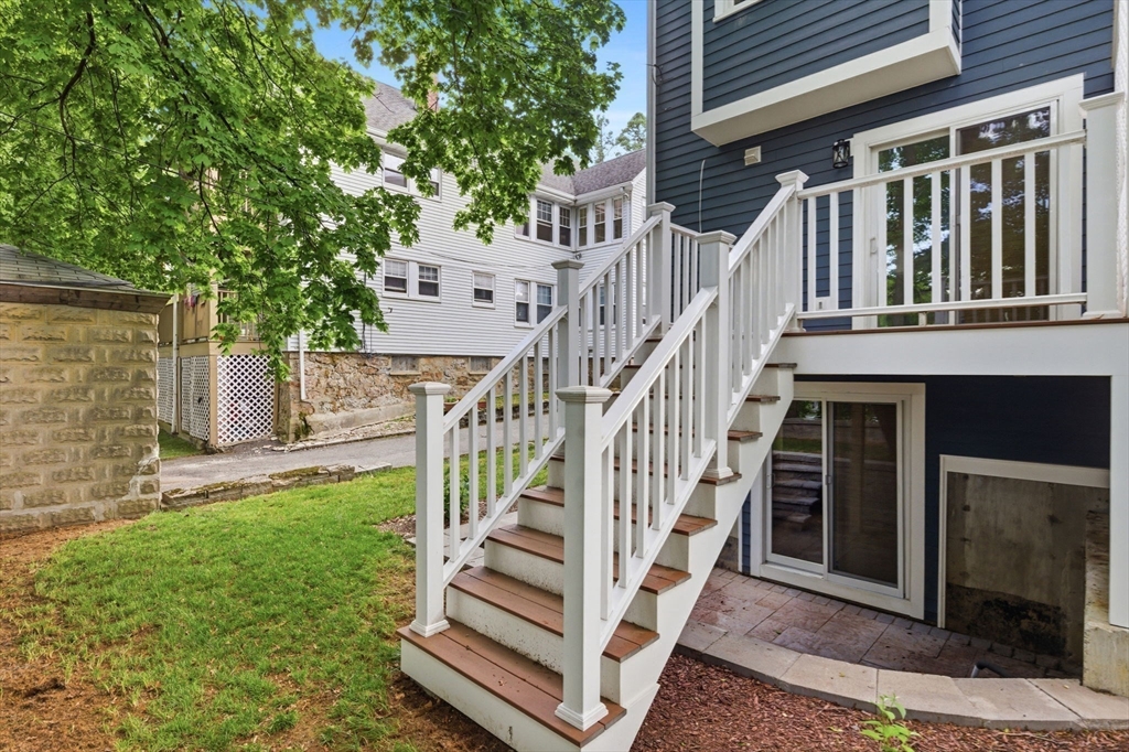123 Nottinghill Road, Unit 2 Boston, MA 02135 - Photo 27 of 30 a view of a house with backyard and deck