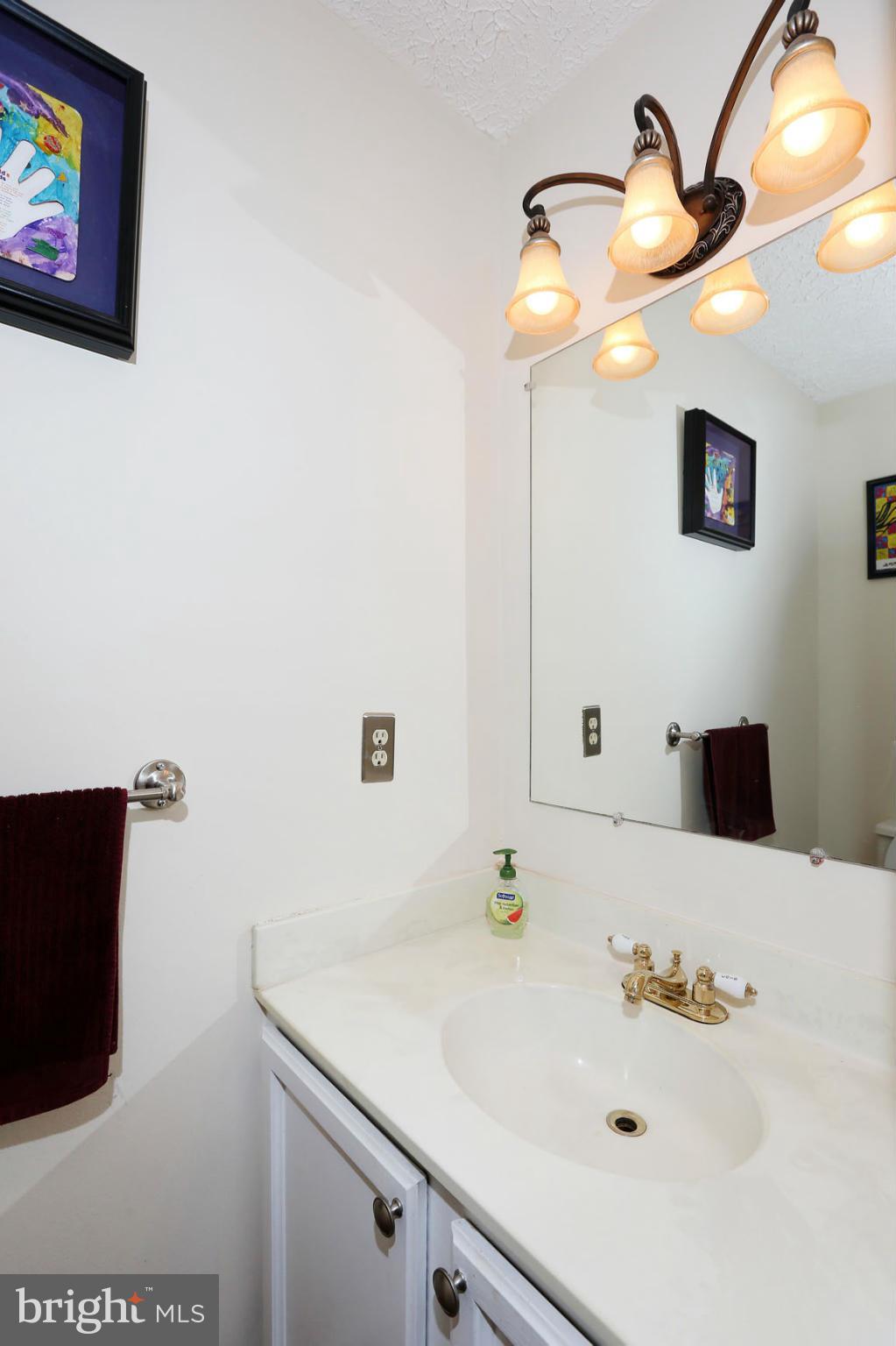 1816 Windjammer Way Gaithersburg, MD 20879 - Photo 13 of 29 a bathroom with a sink and a mirror