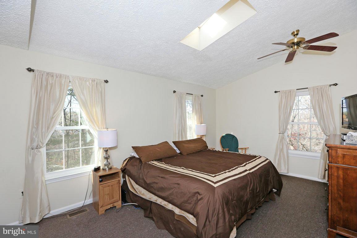 1816 Windjammer Way Gaithersburg, MD 20879 - Photo 15 of 29 a bedroom with a bed and a window