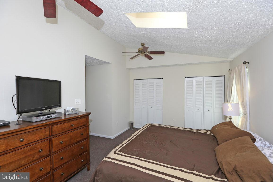1816 Windjammer Way Gaithersburg, MD 20879 - Photo 16 of 29 a living room with furniture and a flat screen tv