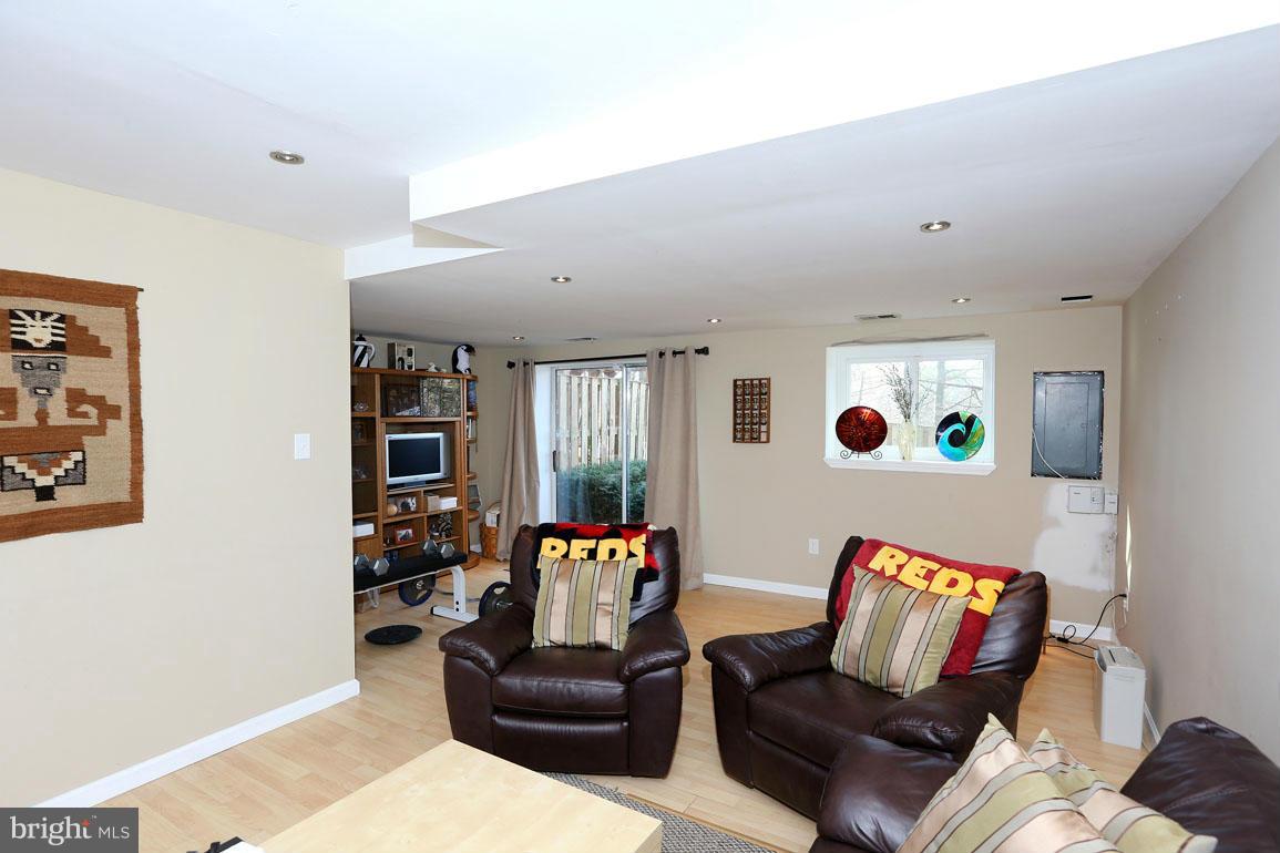1816 Windjammer Way Gaithersburg, MD 20879 - Photo 21 of 29 a living room with furniture and a wooden floor